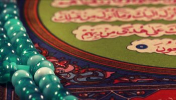 Quran the holy book of muslim religion and Pray Counting Bead Photo